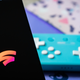 A photo of a controller in the background and the Stadia logo on a phone in the foreground